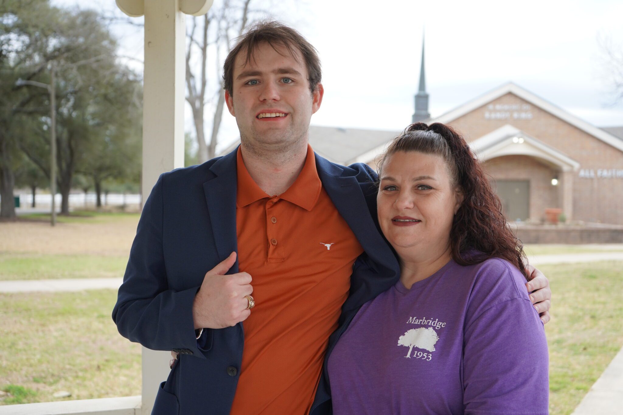 A man standing next to a woman on a porch at Marbridge.