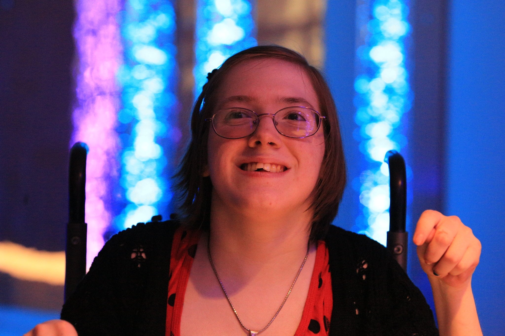 A close-up of a smiling woman in the Sensorium.